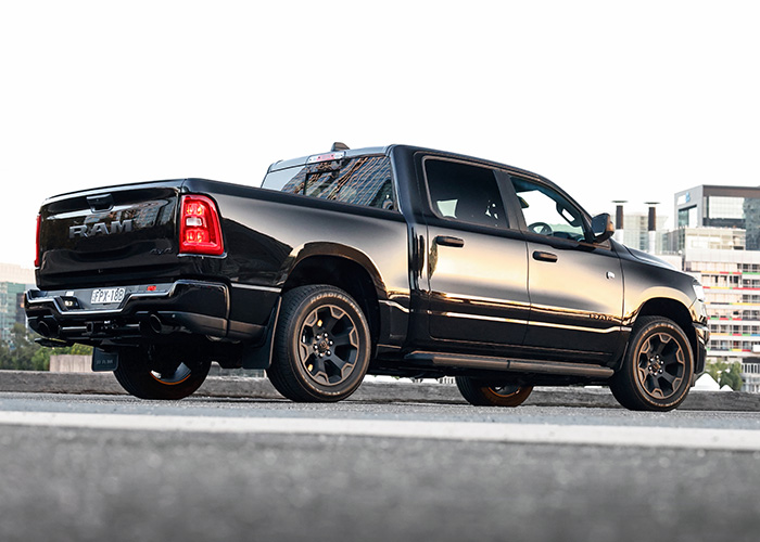 Rear side of a black RAM 1500 truck