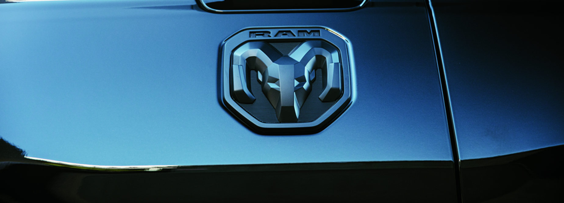 Close up of a RAM badge on the rear tray of a truck